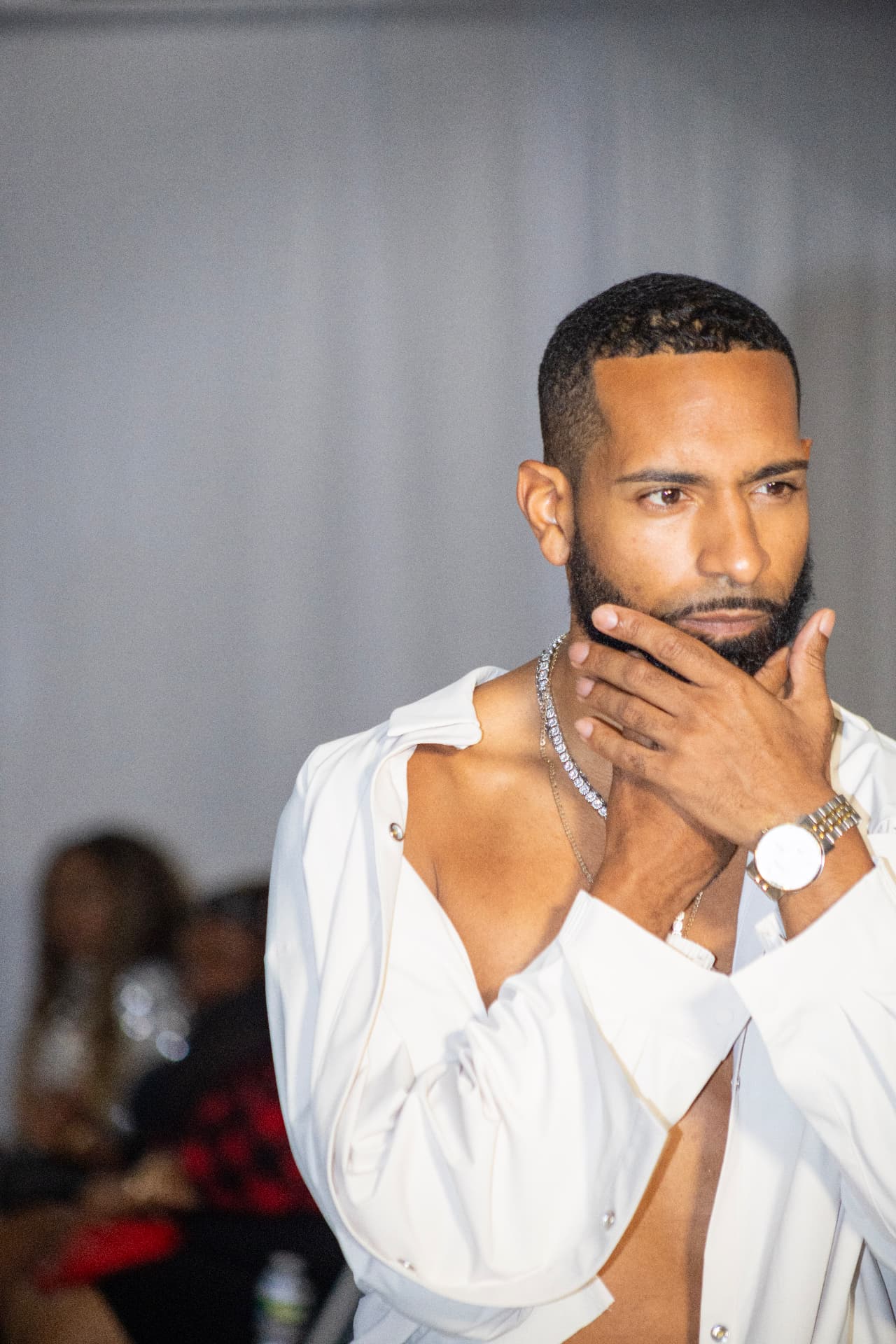 Runway — white shirt, bold chains