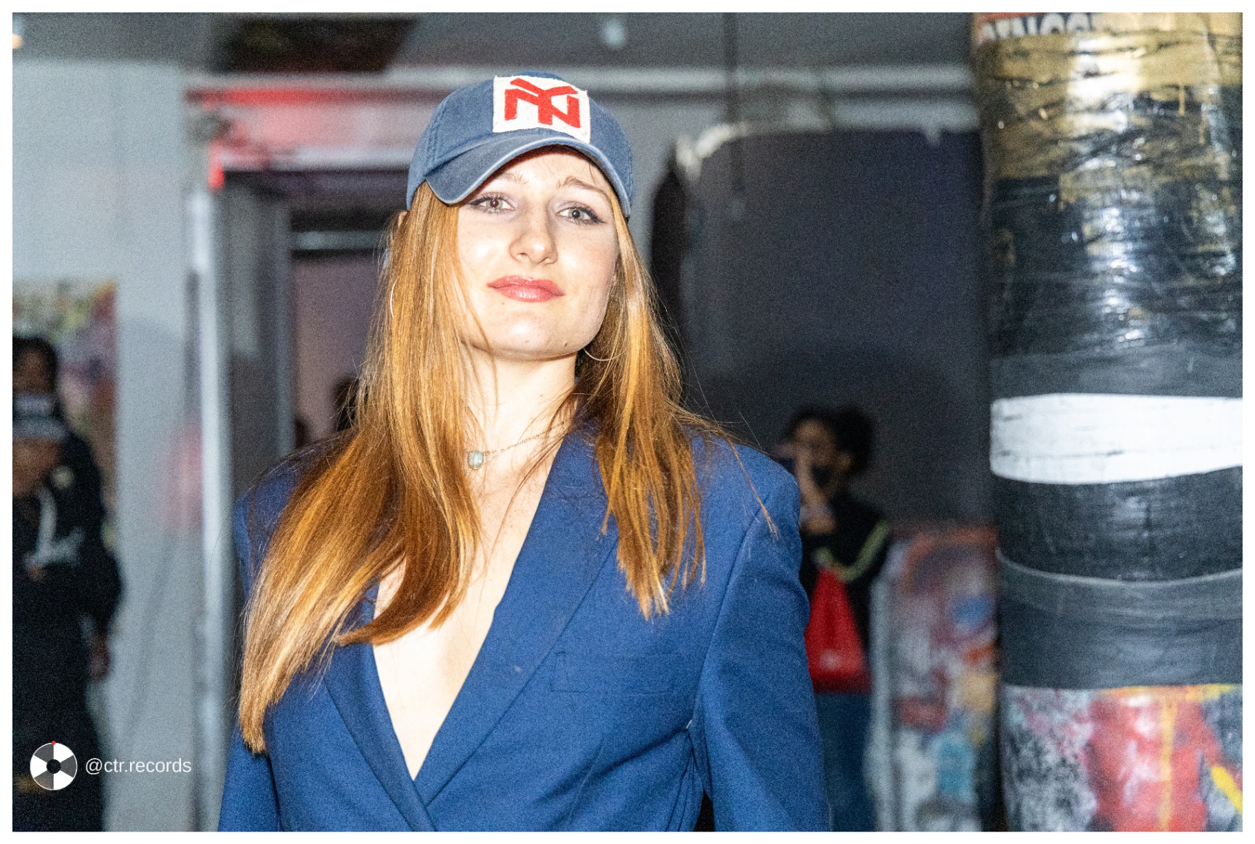 Blue blazer and NY cap