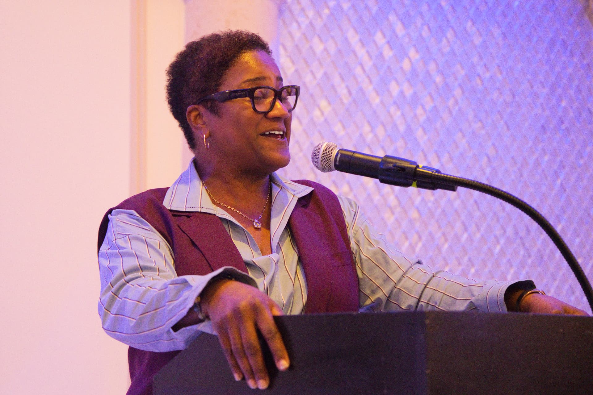 At the microphone — sharing a smile